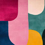 Bright and vibrant mosaic pattern hand tufted wool area rug, perfect for adding a splash of color to your dining room or living room. This contemporary rug features bold geometric shapes in shades of pink, yellow, teal, and navy, ideal for modern and stylish interiors.