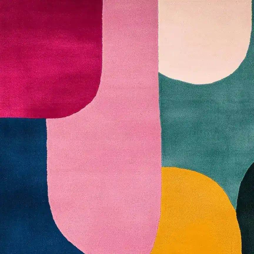 Bright and vibrant mosaic pattern hand tufted wool area rug, perfect for adding a splash of color to your dining room or living room. This contemporary rug features bold geometric shapes in shades of pink, yellow, teal, and navy, ideal for modern and stylish interiors.