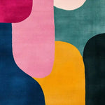 Vibrant Mosaic Pattern Hand Tufted Wool Rug featuring an abstract design with bold colors like pink, teal, and mustard. Perfect contemporary area rug for dining rooms and living rooms, adding a modern touch to your space.