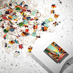 Vibrant Urban Vibes puzzle pieces spilling from white box across speckled surface