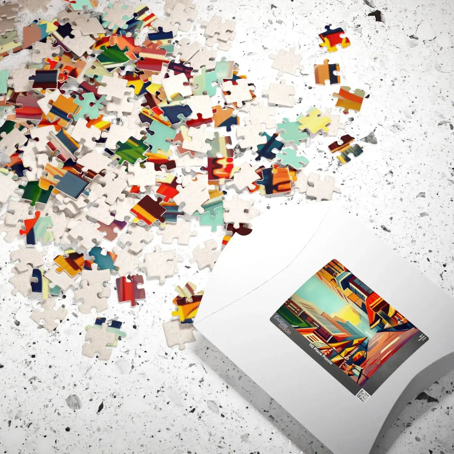 Vibrant Urban Vibes puzzle pieces spilling from white box across speckled surface