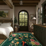 A vibrant vintage hand tufted area rug in a living room setting, featuring a lively floral and bird pattern on a green background. This wool rug is a large square area rug, perfect for enhancing the aesthetic of any living room with its colorful and intricate design.