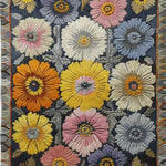 Close-up view of a Victorian Vignette Hand Tufted Wool Rug, showcasing vibrant floral patterns in hues of orange, yellow, pink, and blue. This vintage area rug is perfect for adding a touch of elegance to large living room spaces, combining classic charm with the durability of wool.