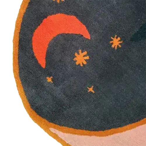 Close-up view of the Dark Night Hand-Tufted Area Rug, showcasing a vibrant abstract design with a crescent moon and stars. Perfect for large living rooms, this wool rug in an 8x10 size adds a touch of elegance and warmth to any space.