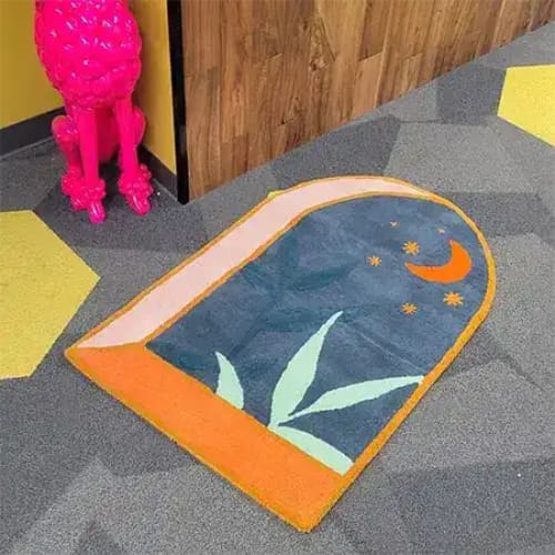 A uniquely designed hand-tufted area rug featuring a dark night theme, perfect for large living room spaces. The rug showcases an abstract night sky with a crescent moon and stars, adding a whimsical touch to any decor. Its wool construction ensures durability and comfort, making it an ideal choice for living room rugs sized 8x10.
