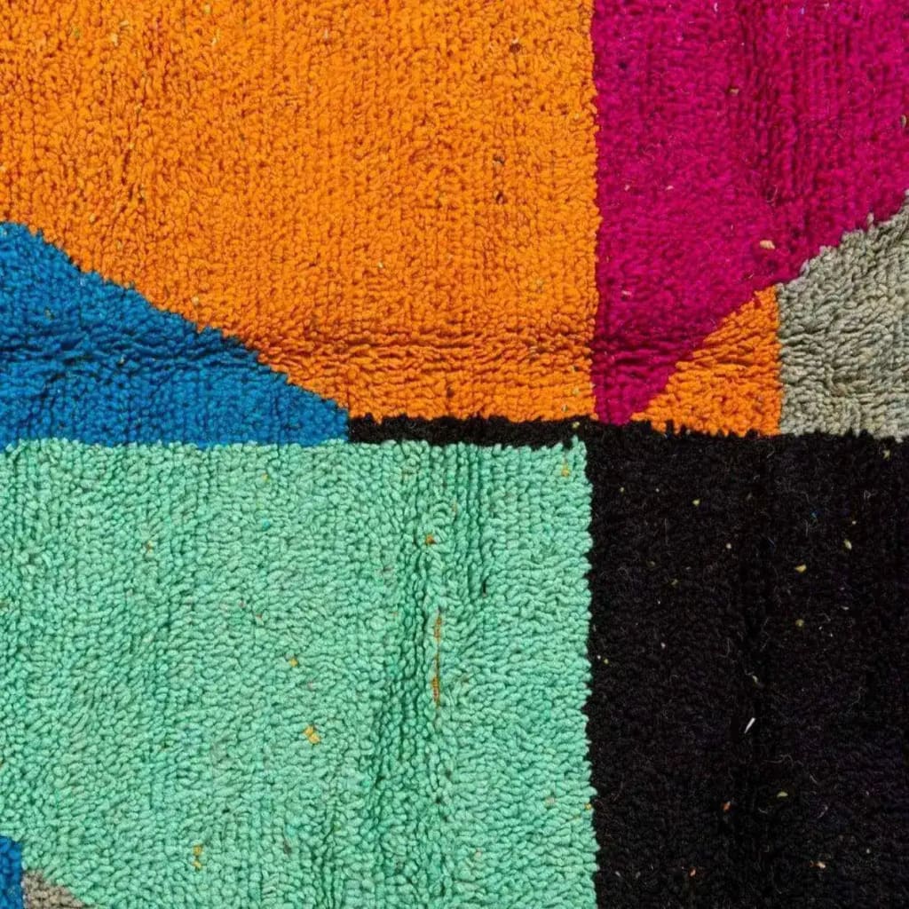 Close-up view of a vibrant Vinai Moroccan Berber handwoven colorful runner rug showcasing bold geometric patterns with rich colors like orange, teal, blue, and pink. Ideal for use as a kitchen rug, wool rug, bathroom runner rug, hallway runner rug, or kitchen runner rug.