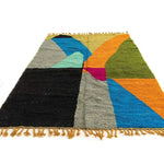 Colorful Moroccan Berber handwoven runner rug featuring vibrant geometric patterns in shades of blue, orange, green, and pink. Ideal as a wool rug for kitchens, bathrooms, or hallways, adding a splash of color and texture to any space.