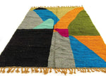 Colorful Moroccan Berber handwoven runner rug featuring vibrant geometric patterns in shades of blue, orange, green, and pink. Ideal as a wool rug for kitchens, bathrooms, or hallways, adding a splash of color and texture to any space.