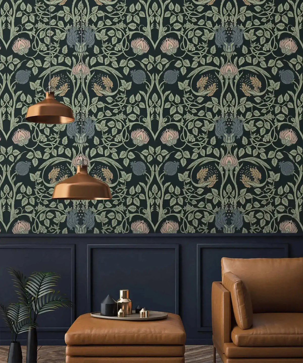Vine and flower wallpaper above dark navy molding panels with tan leather armchair and twin copper pendant lights
