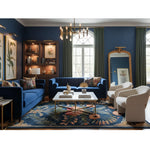 Vintage Aurum Garden navy floral rug in living room with blue sofas and cream chairs