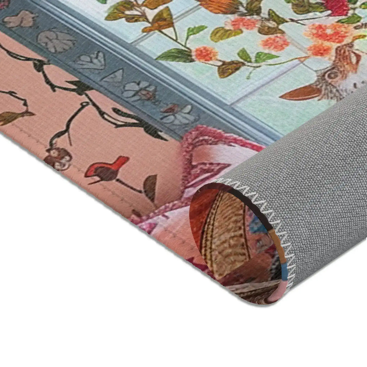 Rolled corner of the Vintage Bohemian Woven Rug revealing grey non-slip backing, orange-red woven pattern on face visible at top
