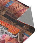 Rolled edge of the Vintage Bohemian Woven Rug showing underside backing, rust-red and navy blue woven stripe pattern on face
