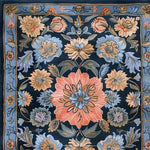 Close-up view of a Vintage Bouquet Hand Tufted Area Rug showcasing a vibrant floral design with intricate patterns in shades of blue, pink, and beige. This wool rug is perfect for enhancing the elegance of a living room or a formal dining room, resembling classic Persian rugs.