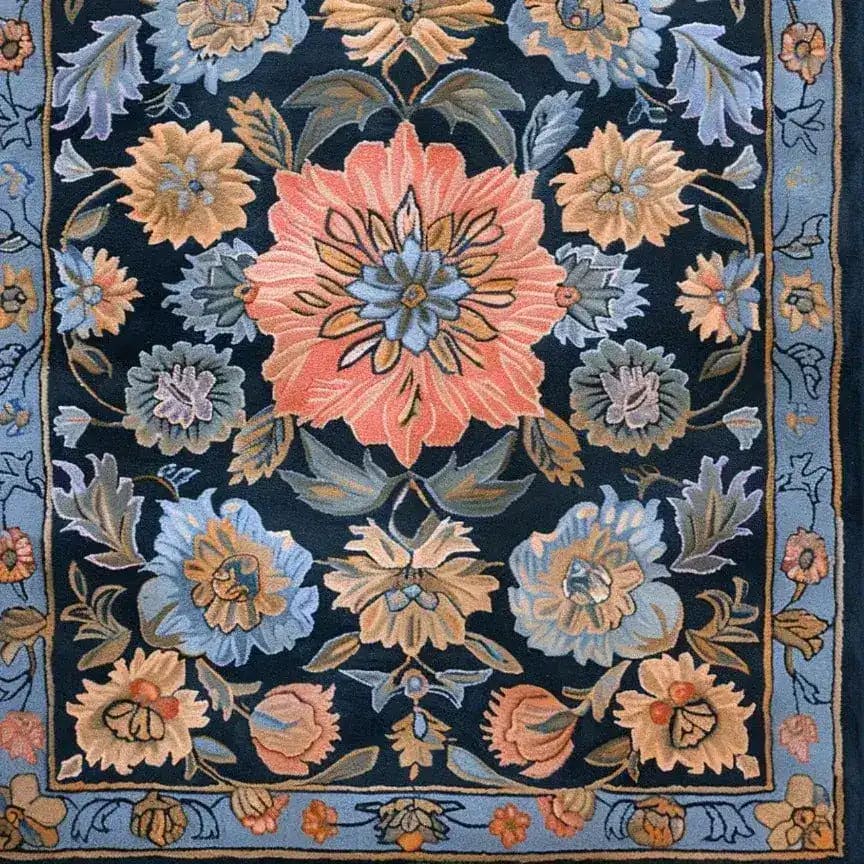 This image features a Vintage Bouquet Hand Tufted Area Rug with a floral design, showcasing intricate patterns in soft hues on a dark background. Ideal for adding elegance to living rooms, dining rooms, or formal dining spaces, this wool rug evokes the charm of traditional Persian rugs.