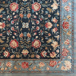 This vintage charm hand-tufted area rug showcases a stunning floral pattern on a dark background, ideal for enhancing the elegance of your dining room or living room. Made from high-quality wool, this square rug features intricate floral designs in warm tones, perfect for those seeking vintage or floral rugs. It's a perfect addition to your collection of dining room area rugs or area rugs for the living room.