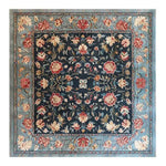 A beautifully crafted Vintage Charm Hand Tufted Rug featuring a vibrant floral pattern in rich colors. This square area rug is perfect for adding a touch of elegance to your dining room or living room. Hand-tufted from wool, this vintage rug showcases intricate floral designs with a harmonious blend of colors, making it an ideal choice for those seeking stylish dining room area rugs or exquisite area rugs for living room spaces.