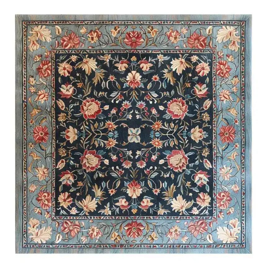 A beautifully crafted Vintage Charm Hand Tufted Rug featuring a vibrant floral pattern in rich colors. This square area rug is perfect for adding a touch of elegance to your dining room or living room. Hand-tufted from wool, this vintage rug showcases intricate floral designs with a harmonious blend of colors, making it an ideal choice for those seeking stylish dining room area rugs or exquisite area rugs for living room spaces.