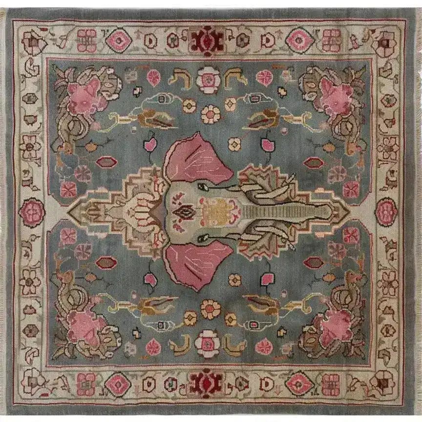 A beautifully handcrafted vintage elephant-themed area rug, perfect for large living rooms. This Persian-style wool rug features intricate designs with a central elephant motif, surrounded by floral patterns. Ideal as a square area rug or living room rug 8x10, it adds a touch of elegance and timeless charm to any space.