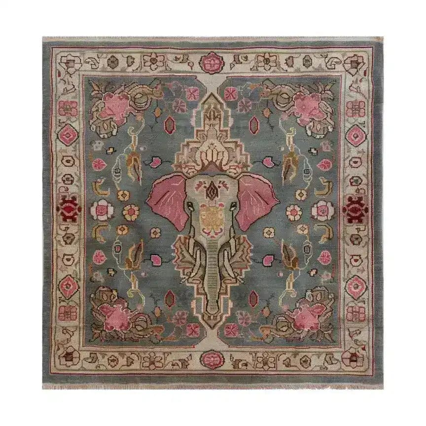 Vintage Elephant Hand Knotted Area Rug featuring a central elephant motif with intricate Persian designs, ideal for large living rooms. This wool square rug showcases a harmonious blend of pink and gray tones, embodying the charm of traditional Persian rugs. Perfect for those seeking a unique 8x10 living room rug that adds elegance and character to any space.