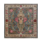Vintage Elephant Hand Knotted Area Rug featuring a central elephant motif with intricate Persian designs, ideal for large living rooms. This wool square rug showcases a harmonious blend of pink and gray tones, embodying the charm of traditional Persian rugs. Perfect for those seeking a unique 8x10 living room rug that adds elegance and character to any space.