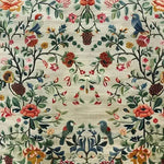 A beautifully detailed vintage floral hand tufted area rug featuring an intricate design of colorful flowers and birds on a soft, muted background. Perfect as a wool rug for adding elegance to a living room or bedroom, this floral rug captures a classic vintage aesthetic ideal for living room area rugs or as a statement piece in rugs for a bedroom.