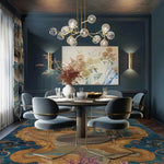 A beautifully styled dining room featuring a Vintage Frame Hand Tufted Area Rug under a round dining table. The large vintage rug showcases intricate patterns in warm tones, perfectly complementing the elegant blue dining chairs and modern chandelier. This wool rug adds a touch of sophistication to the dining room, making it an ideal choice for dining room carpets and large area rugs.