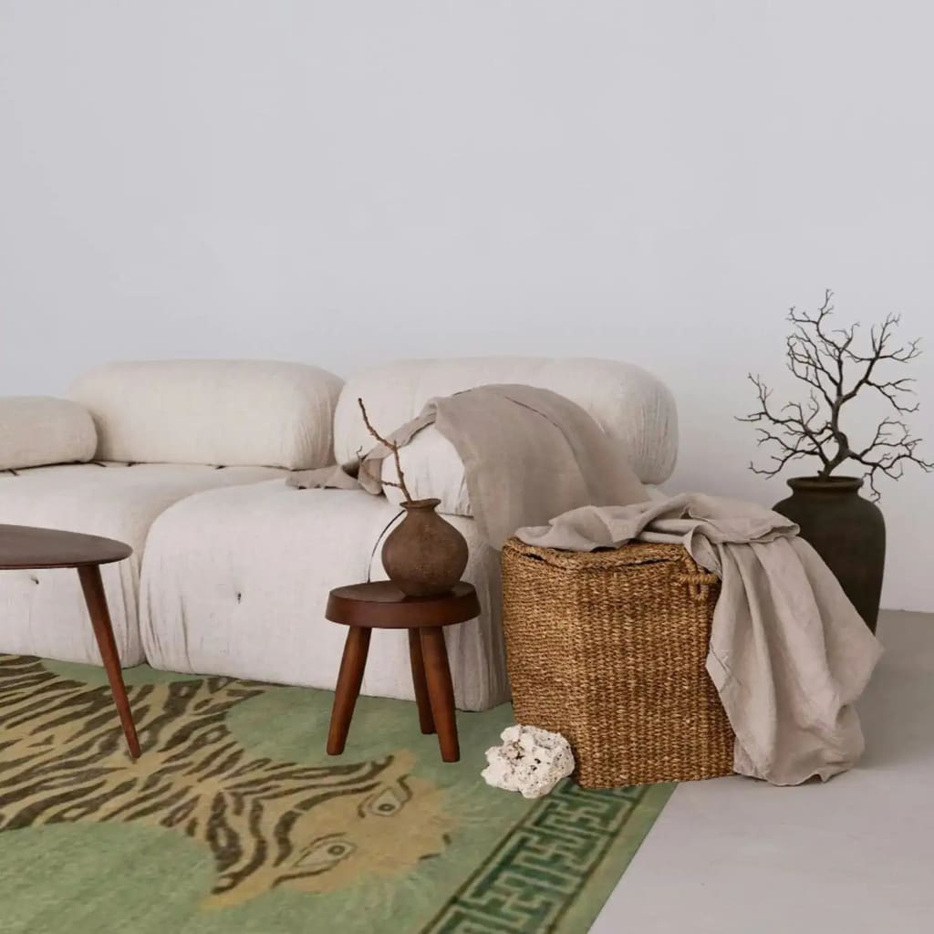 Cozy living space featuring a Vintage Green Hand Knotted Tiger Wool Rug. The area rug showcases an abstract tiger design, enhancing the room's aesthetic. Perfect for bedroom area rugs or office use, this wool rug adds warmth and style to any setting.
