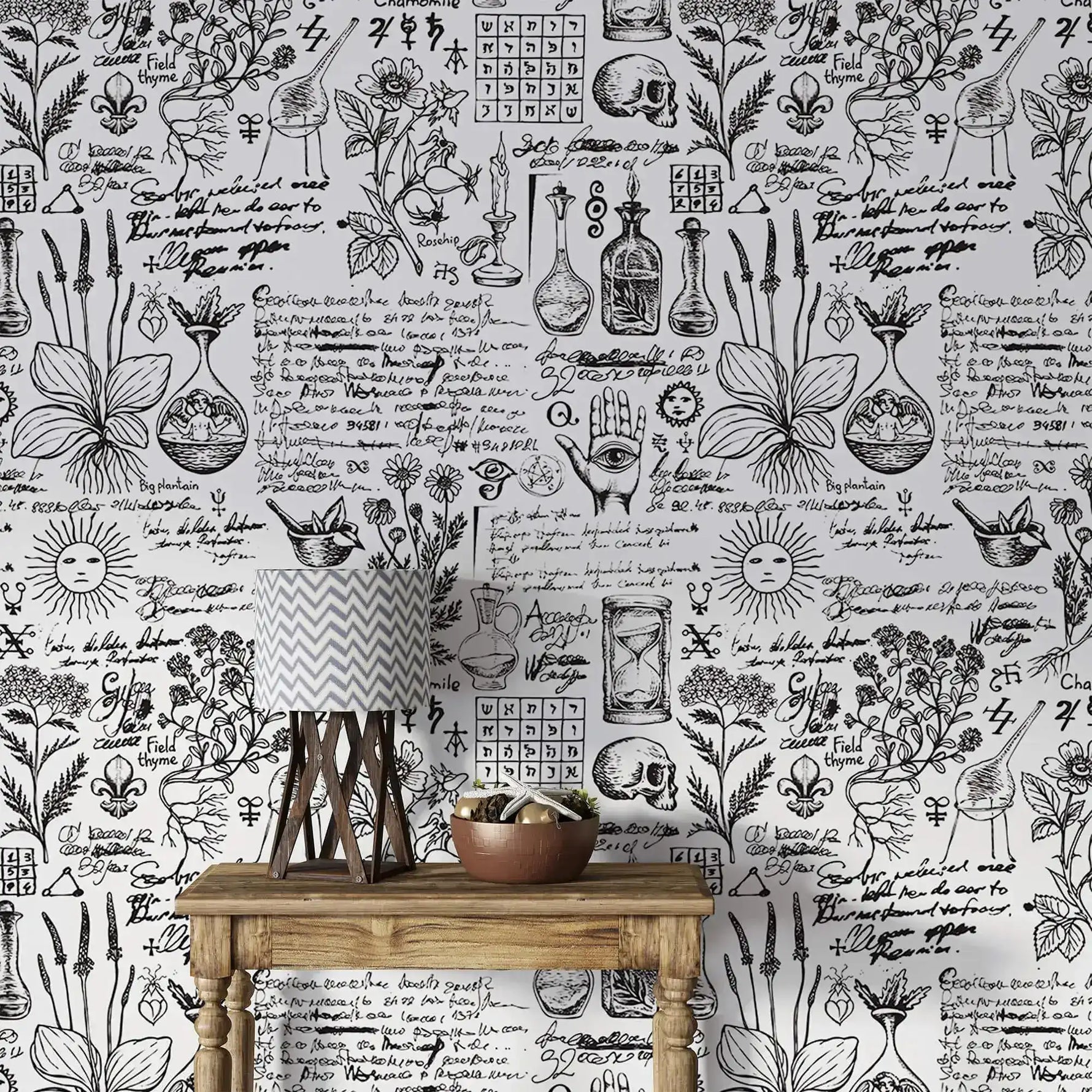 Vintage herbal alchemy wallpaper showing botanical sketches and script behind a rustic console with lamp