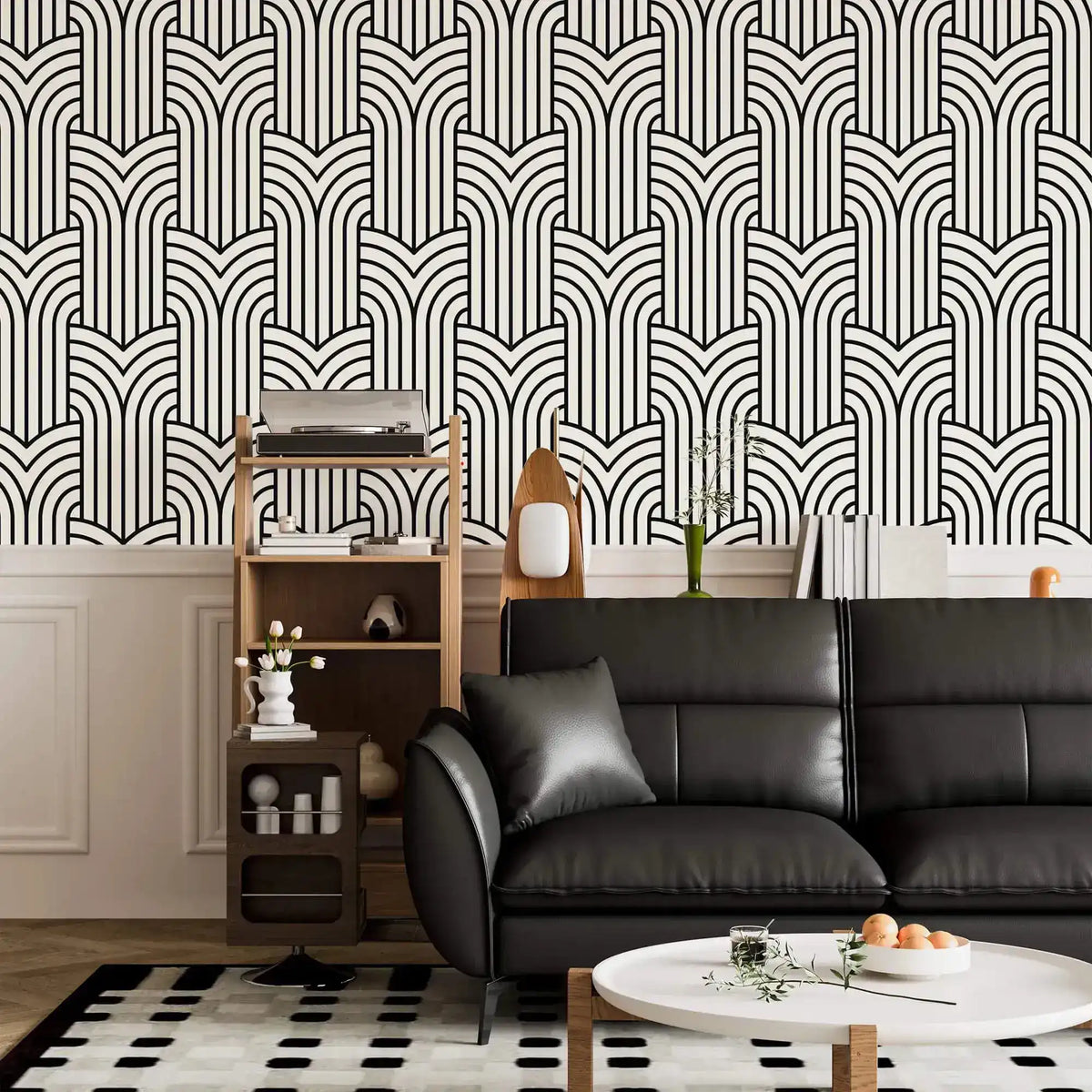 Vintage ornate outline wallpaper in living room, black art deco arches on cream above a black leather sofa