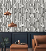 Vintage ornate outline wallpaper over navy paneling with copper pendants, black art deco arches on cream