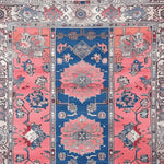 Vibrant Vintage Radiance Hand Knotted Area Rug showcasing intricate Persian designs in bold blue and pink tones. Perfect as a centerpiece for rugs for living room, this vintage rug adds a touch of elegance to any space. Ideal for living room rugs 8x10, its detailed patterns bring an authentic Persian rug feel.