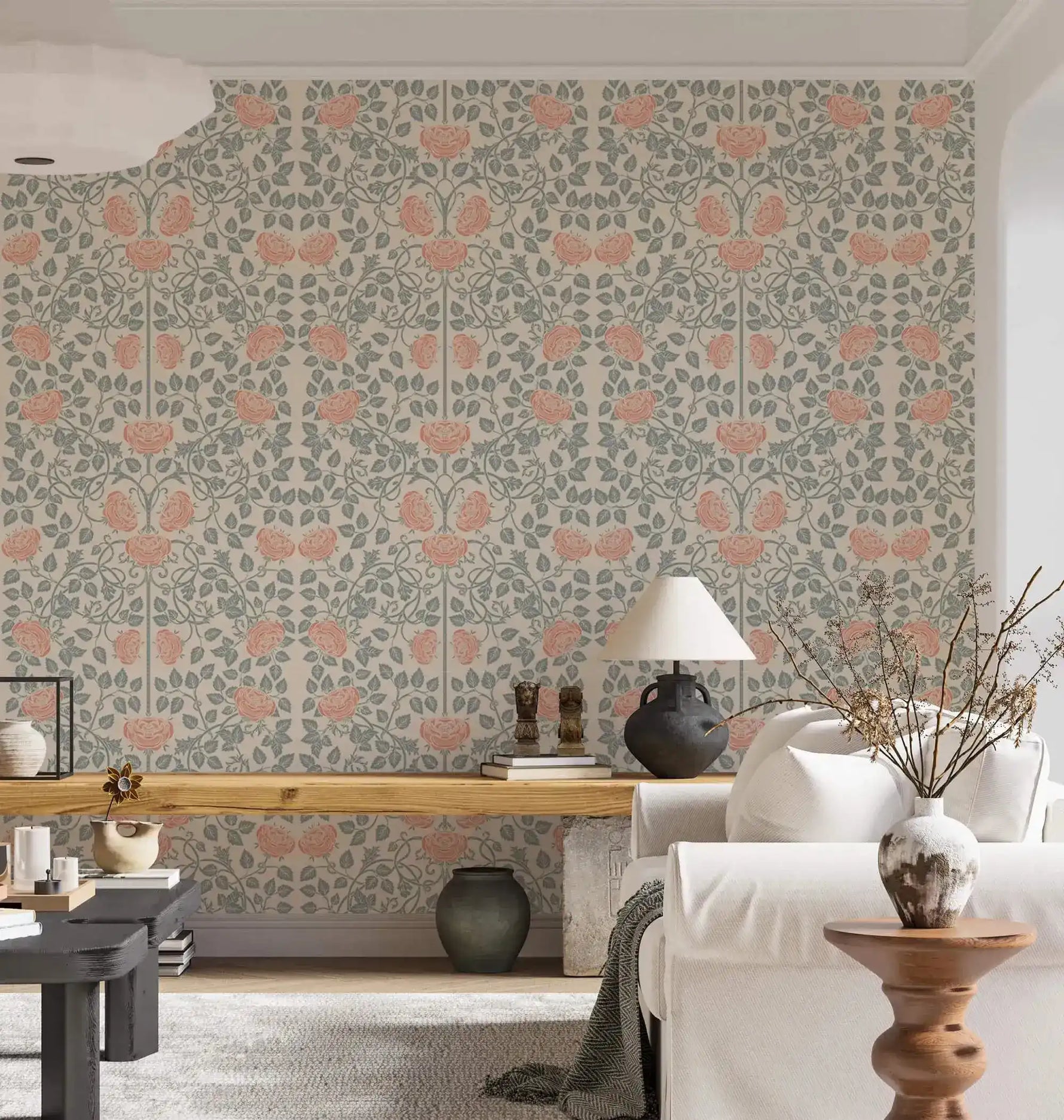 Vintage rose garden wallpaper in airy living room, coral roses on sage trellis behind a white sofa