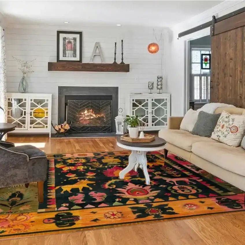 A beautifully styled living room featuring a Vintage Swedish Tapestry Wool Hand Knotted Area Rug. The square rug, with its vibrant patterns and colors, adds warmth and character to the wooden floor. Perfect for those seeking large area rugs to enhance their living room decor.