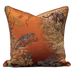Vintage toucan jacquard throw pillow cover featuring intricate animal and foliage designs on a rich orange background.