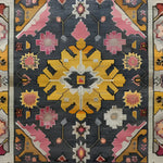 A beautifully crafted Vintage Tribal Hand Knotted Area Rug featuring a stunning geometric pattern with vibrant colors like yellow, pink, and grey. This exquisite Persian rug is perfect for those seeking a vintage rug to elevate their living space, making it an ideal choice for area rugs in the living room or large living room rugs.