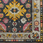 A vibrant vintage tribal hand-knotted area rug showcasing a bold geometric and floral design. The rug features a striking combination of yellow, pink, and grey hues, perfect for adding a touch of Persian elegance to any living room. Ideal for those seeking large living room rugs with a vintage flair.