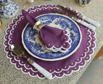 Violet vigor round purple scalloped placemat with white dot border, violet liner, blue floral china, purple napkin