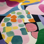Close-up of a colorful abstract patterned fabric with vibrant colors.