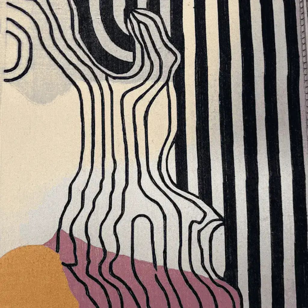 Close-up view of a contemporary area rug featuring bold, abstract black and white stripes with organic line patterns, perfect for adding a modern touch to any living room or bedroom. This hand-tufted wool rug incorporates subtle hues of pink and mustard, making it an eye-catching addition to your home decor.