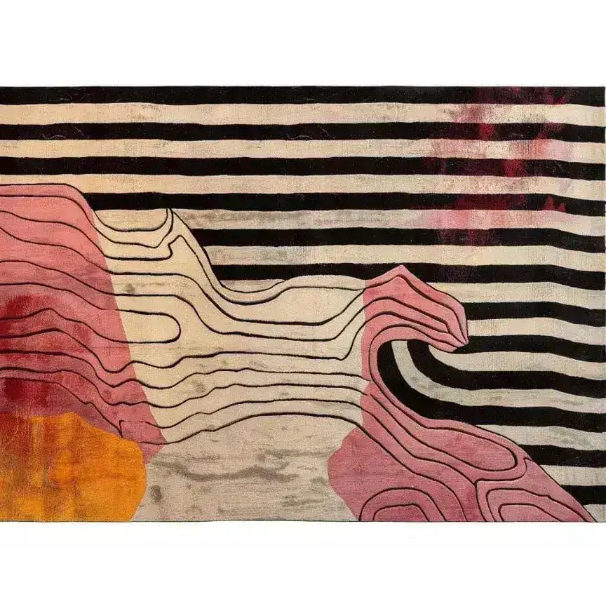 A vibrant hand-tufted area rug featuring bold black and white stripes with abstract pink and orange shapes. Perfect for adding a contemporary touch to living rooms or bedrooms, this wool rug offers an artistic flair to any space.