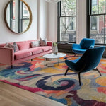 A vibrant and colorful area rug adds a lively touch to a stylish living room. The wool rug features swirling abstract patterns in bold hues, perfectly complementing the modern decor. This large area rug is ideal for bedrooms or living rooms, providing a plush and inviting atmosphere. The square rug's dynamic design enhances the contemporary look of the space, making it a standout piece among rugs for bedrooms and large area rugs for living rooms.