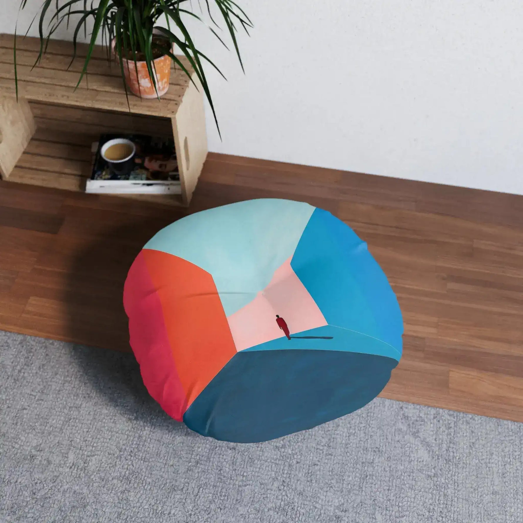 Void Walk Floor Pillow front view on white background with figure silhouette in geometric blue and orange-red hallway scene