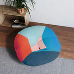 Void Walk Floor Pillow styled in room on gray rug with wooden shelf behind, figure corridor art facing front