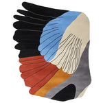 Top view of the Volcanic Fan Drift Hand Tufted Rug, an abstract area rug perfect for a contemporary living room setting. This colorful wool rug features bold, sweeping designs in shades of black, blue, cream, and red, ideal for adding a touch of modern artistry to your space. Perfect for those seeking living room rugs 8x10 and area rugs for living room.