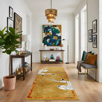 Living room with a decorative rug featuring animal prints, a console table, and wall art.