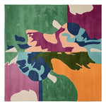 A vibrant and contemporary wool area rug featuring an abstract design in bold colors like green, purple, orange, and blue. This large square rug is perfect for adding a modern touch to any living room space.