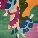 Top view of the Wandering Form Hand Tufted Area Rug showcasing a vibrant abstract design with bold colors like green, orange, pink, and blue. This contemporary wool rug is perfect for large living room spaces, adding a modern touch with its artistic pattern. Ideal as a square area rug for those looking for unique rugs for living room decor.