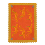 Vibrant area rug with a bold orange and yellow design, featuring artistic leopards. This wool rug offers a unique touch to office decor, showcasing a scalloped edge and intricate patterns.