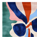 Vibrant abstract-patterned area rug featuring bold colors like blue, green, pink, and orange. This hand-tufted wool rug is perfect for adding a contemporary touch to your living room. Ideal for those seeking large living room rugs or a unique square area rug design.