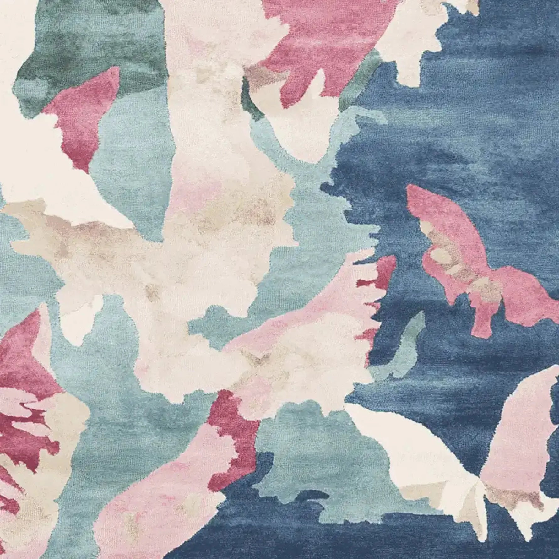 A beautiful watercolor terrain sketch hand tufted area rug featuring an abstract design with shades of blue, pink, and cream. This contemporary wool rug is perfect for adding an artistic touch to living room spaces. Ideal for those seeking unique square area rugs that enhance modern decor.